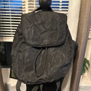 Prada Black Backpack with Padded Straps and Flap Closure